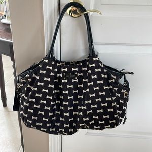 Kate Spade diaper bag converts to a travel/gym bag.  Includes change purse!
